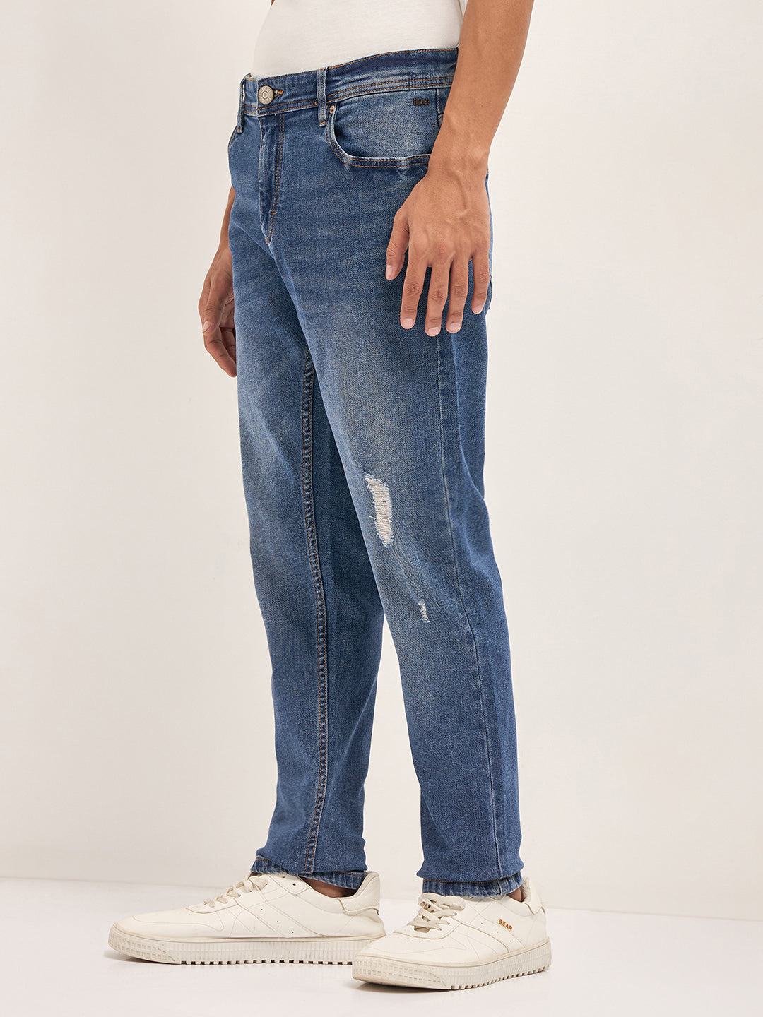 Mid Blue Mid-Rise Slim Fit Jeans with Lightly distressed